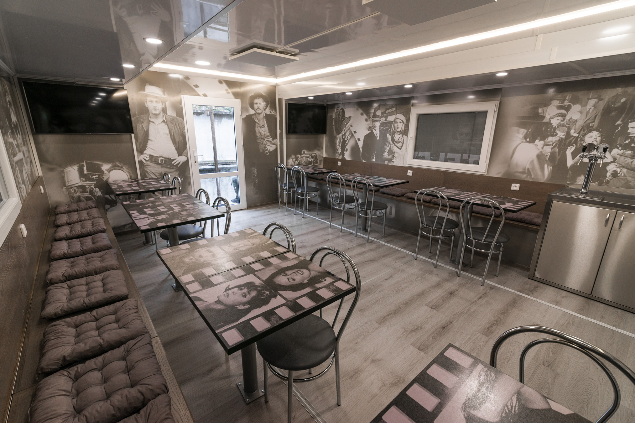 The finished interior from another angle — graphics fitted around walls, windows and doors.