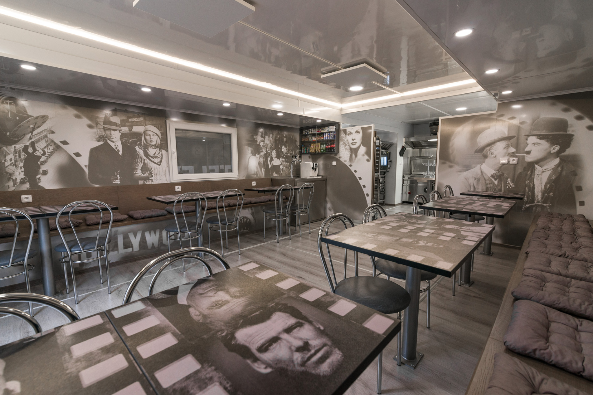 Catering truck / film imagery on tables and walls in the finished interior.