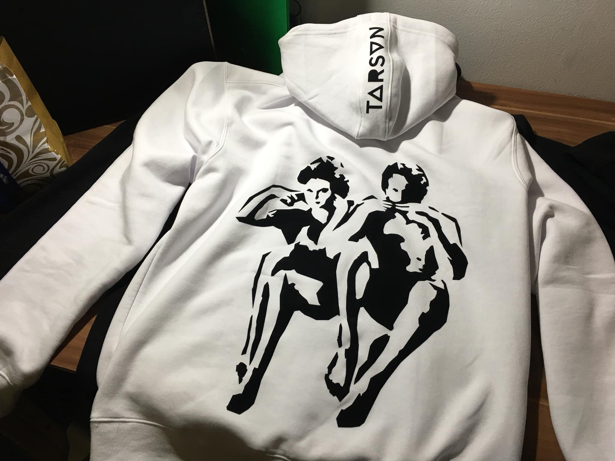 Tarzan and Jane — my own illustration; black flock on a white hoodie.